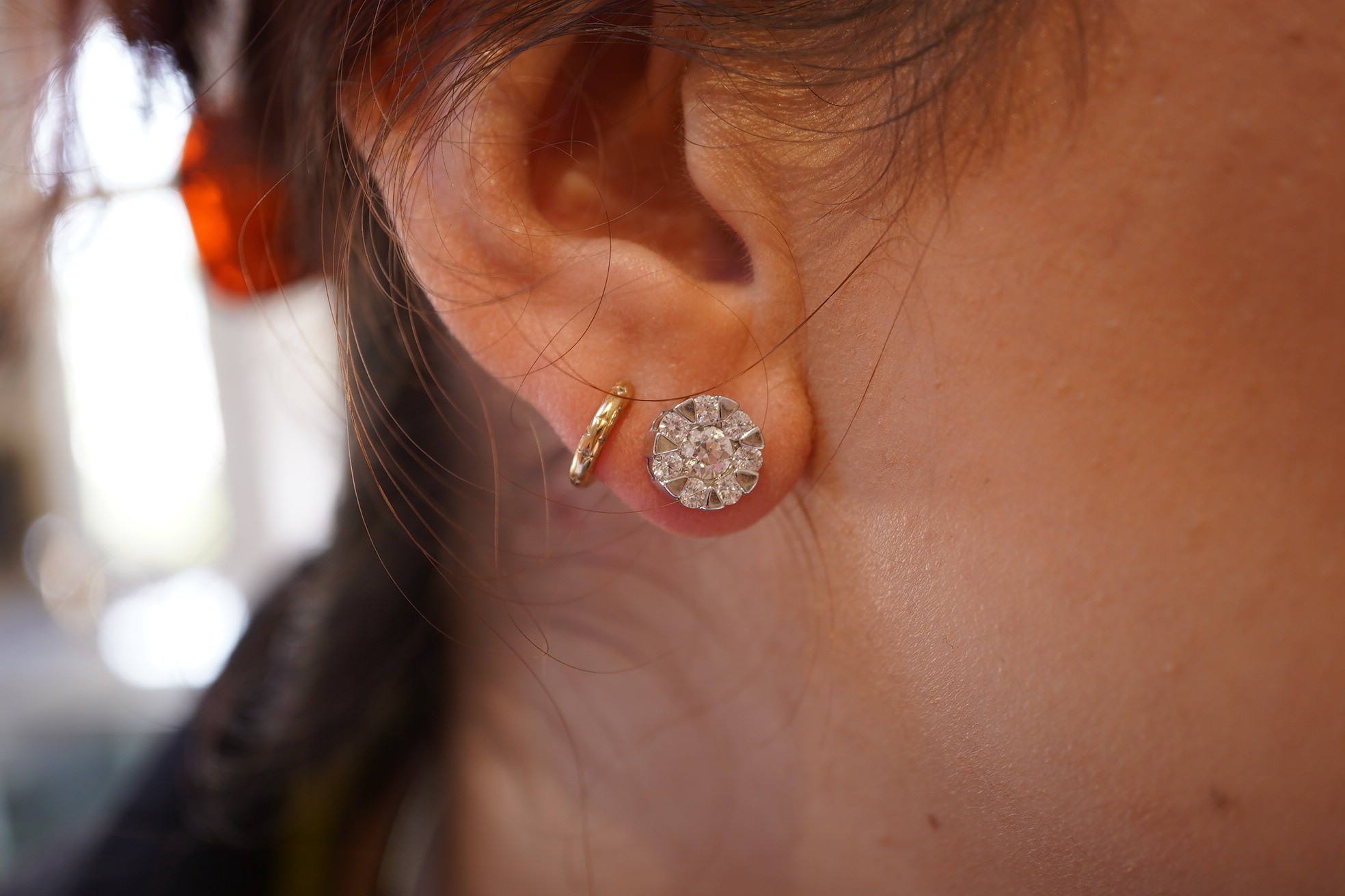 A pair of diamond stud earrings